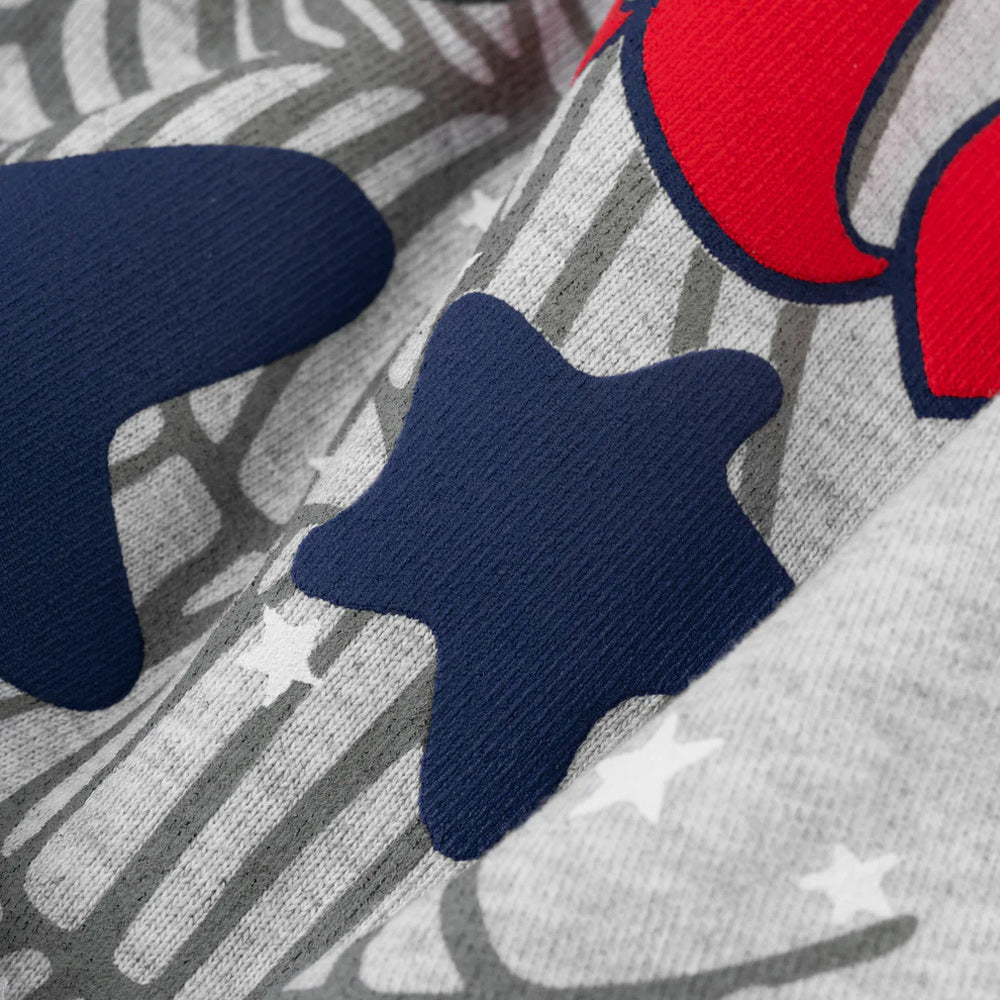Close-up of a fabric with red, blue, and gray patterns