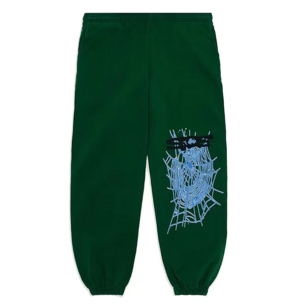 Green sweatpants with a spider web and blue spider design on a white background