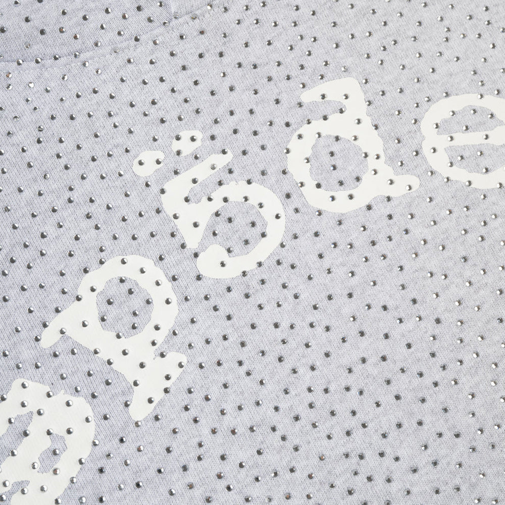 Close-up of a textured fabric with 'sp5der' printed on it.